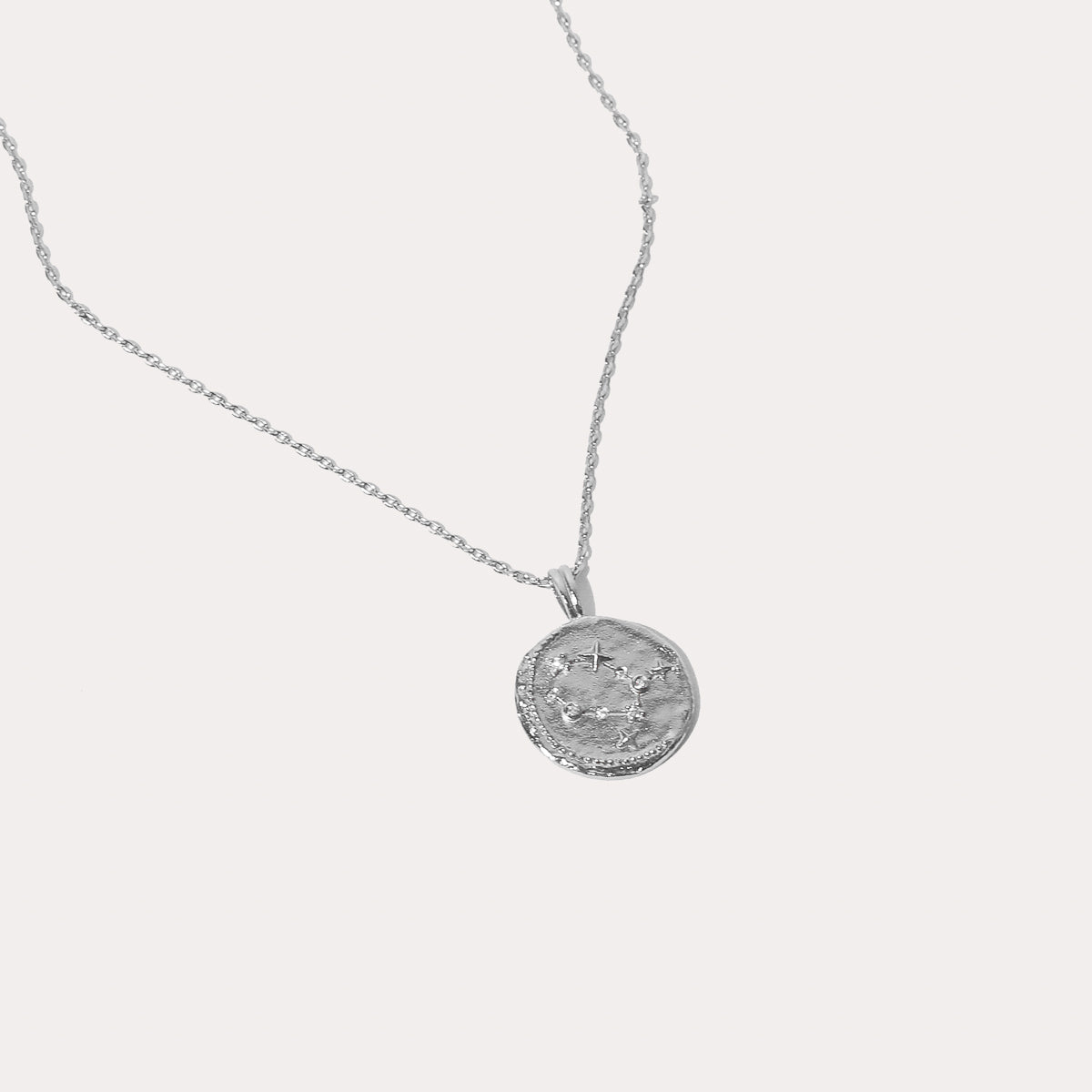 Close up shot of the front of the Gemini Zodiac Pendant Necklace in Silver