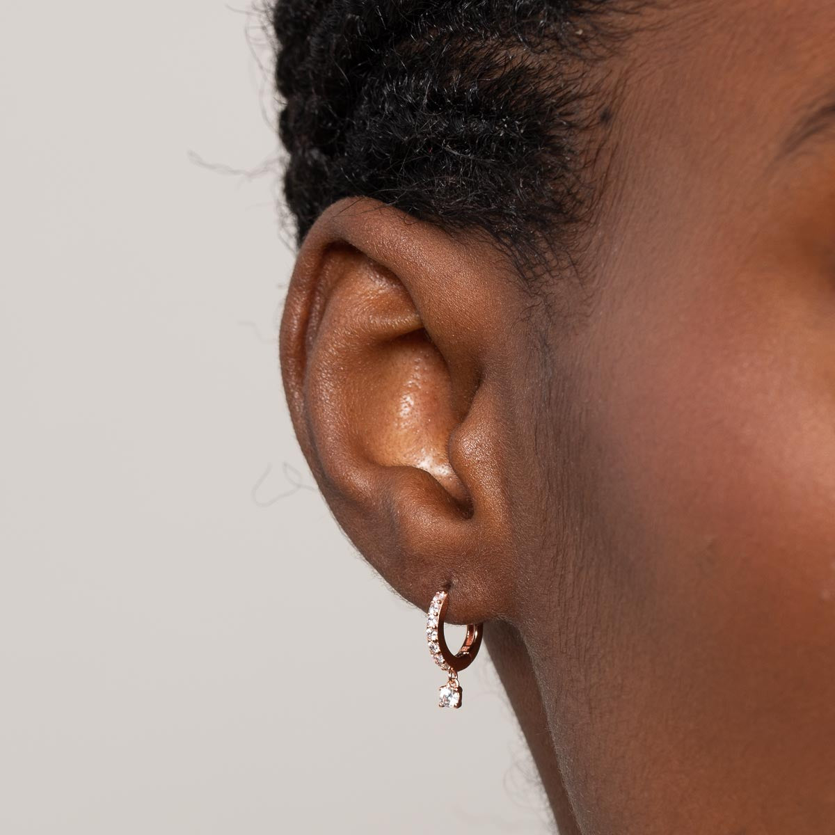 Charm Crystal Huggies in Rose Gold worn