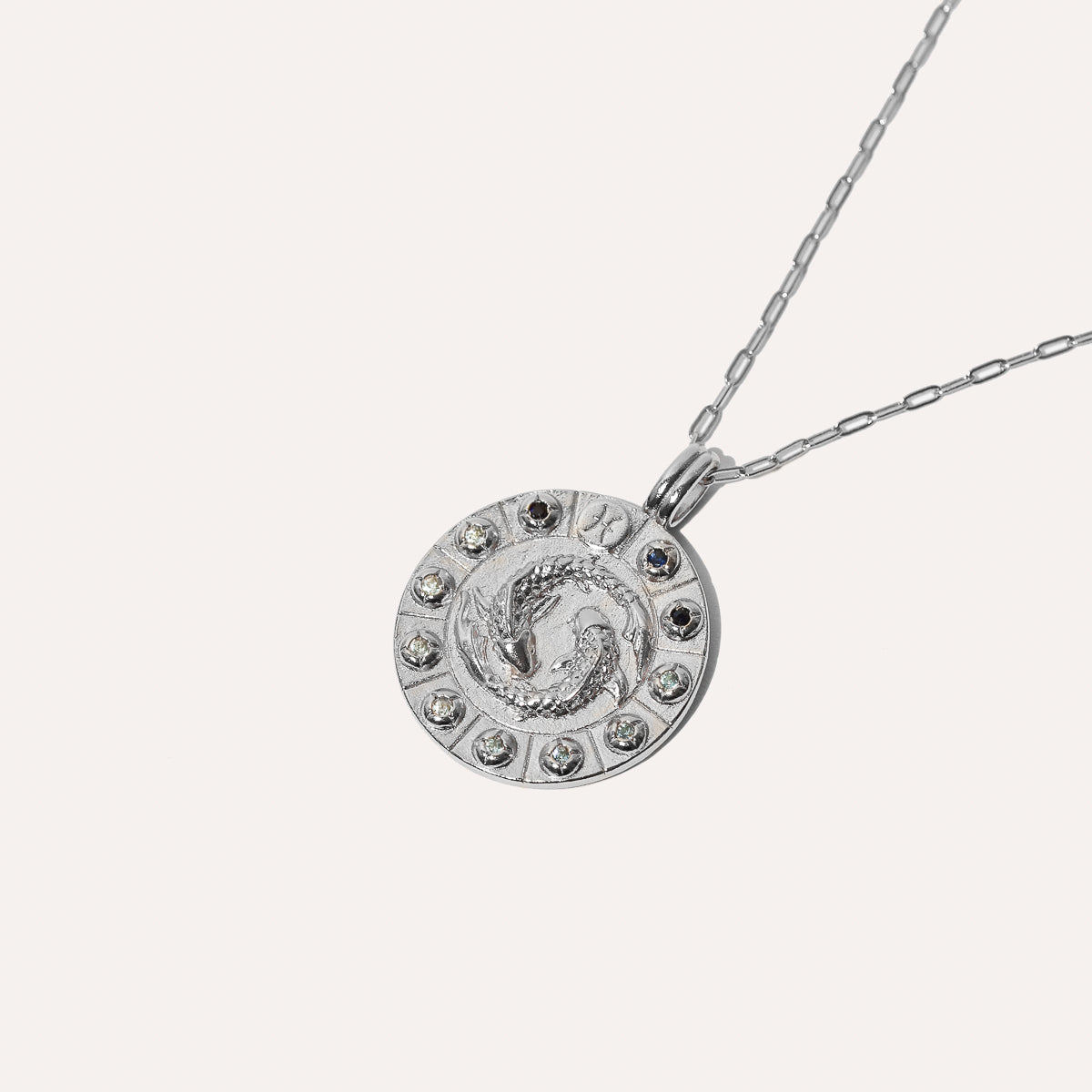 Pisces Bold Zodiac Pendant Necklace in Silver flat lay