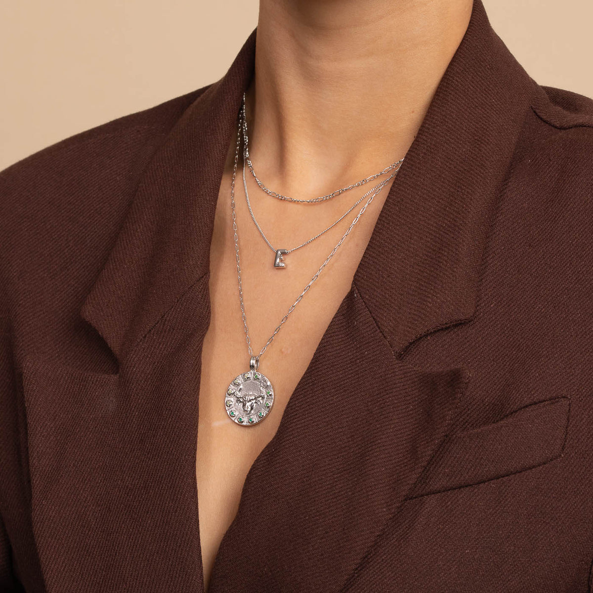 Bold Zodiac Taurus Pendant Necklace in Silver worn layered with necklaces