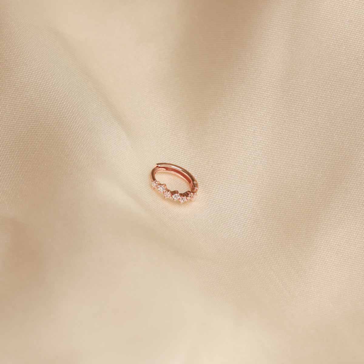Flat lay of Cluster Hoop 8mm in Rose Gold