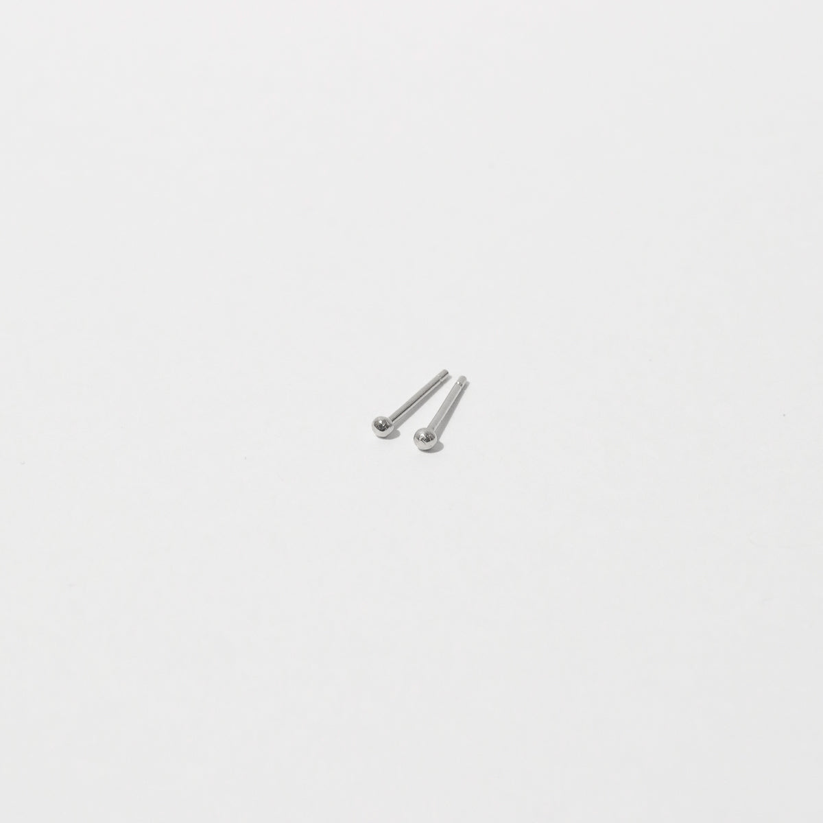 Small Ball Stud Earrings in Solid White Gold flat lay