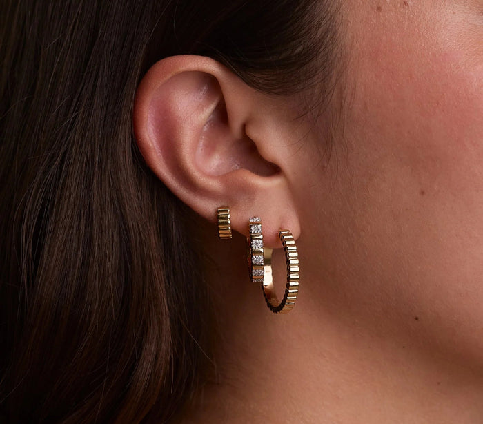 Everyday jewellery essential pieces, including a necklace and hoop earrings