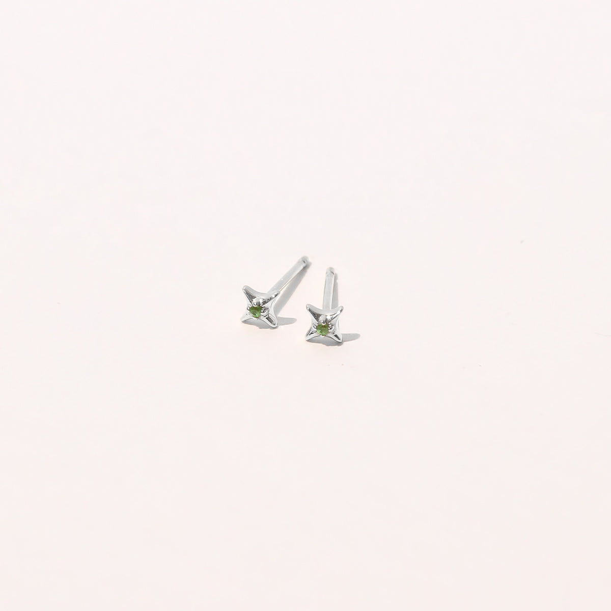 Tsavorite Stud Earrings in Solid White Gold flat lay