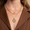 Bold Zodiac Aquarius Pendant Necklace in Gold worn layered with rope chain necklace and bold halo necklace