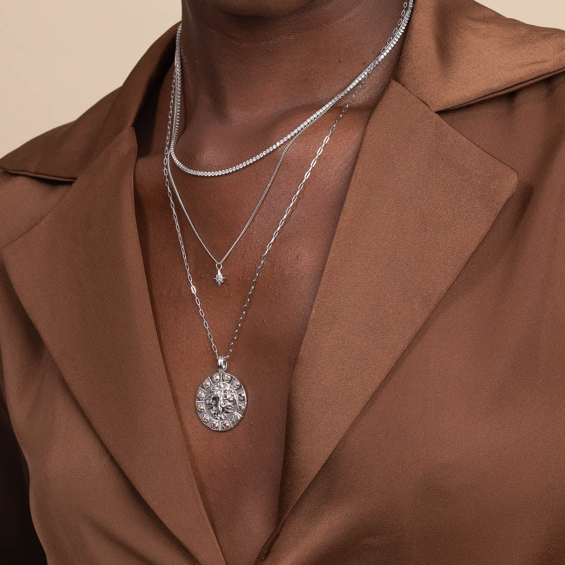 Bold Zodiac Leo Pendant Necklace in Silver worn layered with tennis chain necklace and twilight star pendant necklace