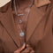 Pisces Bold Zodiac Pendant Necklace in Silver worn layered with necklaces